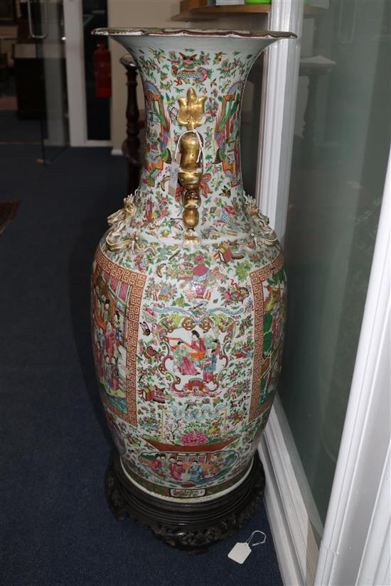 A large Canton floor vase, broken & rivet repaired with carved and pierced hardwood stand